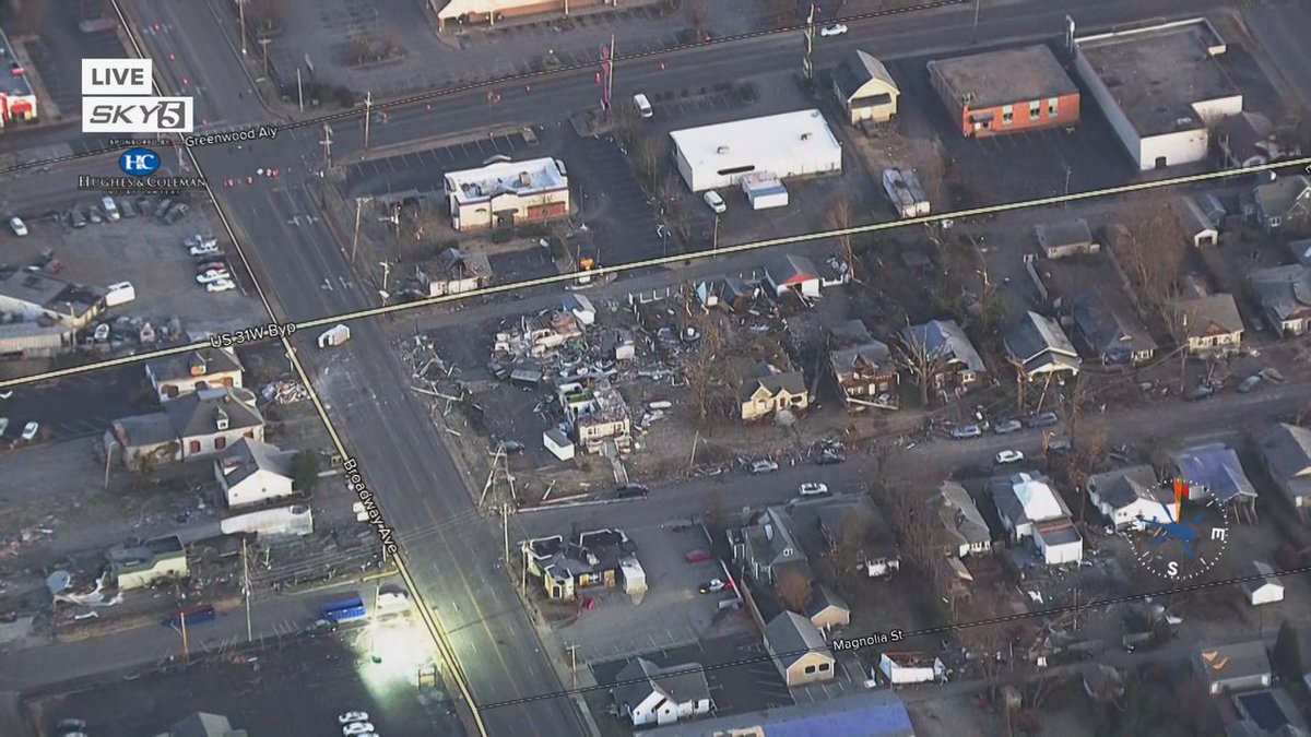 RebCunningham's tweet photo. #Sky5 is live over Bowling Green this morning to survey the damage as the sun comes up. Our @HenryRothenberg is reporting from the helicopter after an EF 3 touched down there #tornadocoverage #KYStrong https://t.co/kOVze2vsa2
