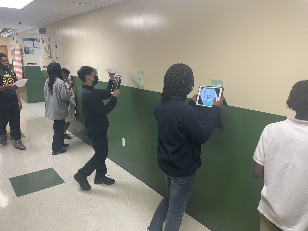 RenStLucie's tweet photo. Students in Mrs. Grillo’s class is using QR codes that when scanned bring up math problems to solve. #rcssl https://t.co/XmEudAQymi