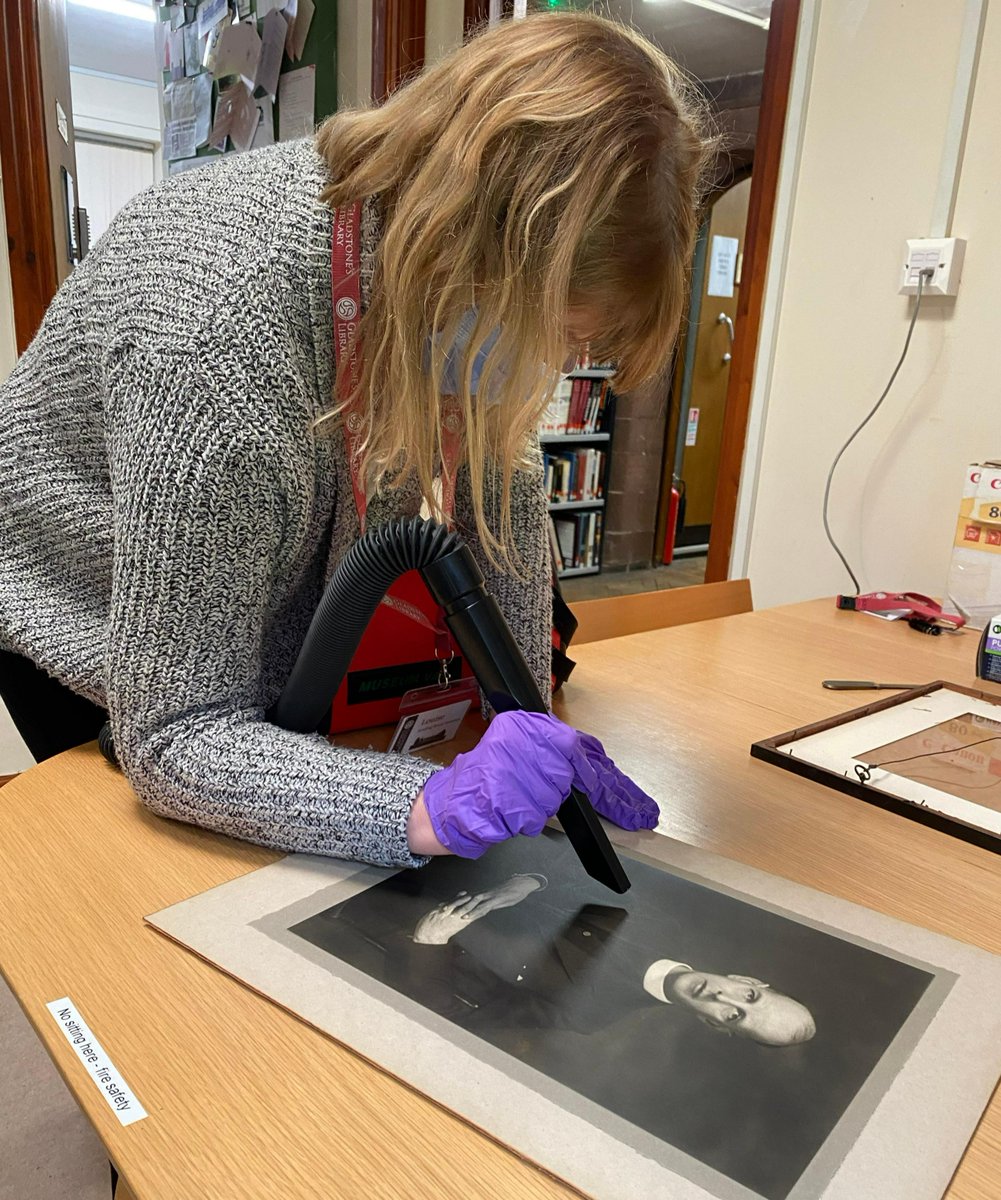 gladlib's tweet photo. Day 13 of #GLADvent: Today our Reading Room Assistant, Louise, is cleaning some of our art collection ready to move them to a better storage space. Our museum vacuum allows us to carefully clean some of the more delicate items in the collection. https://t.co/Cc1gNKRfbN