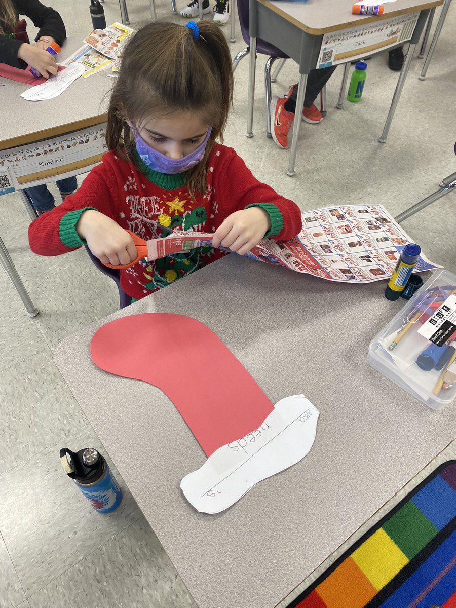 jovteach's tweet photo. Last week we learned the difference between needs and wants. We made stockings by cutting out pictures from catalogs! Snowflake was checking out our display in the hall #ClassroomElf #SnowflakeAdventures #WEStandTogether #becomebelongNYCSD @WESpolarbears https://t.co/qBlB9Ezx3e