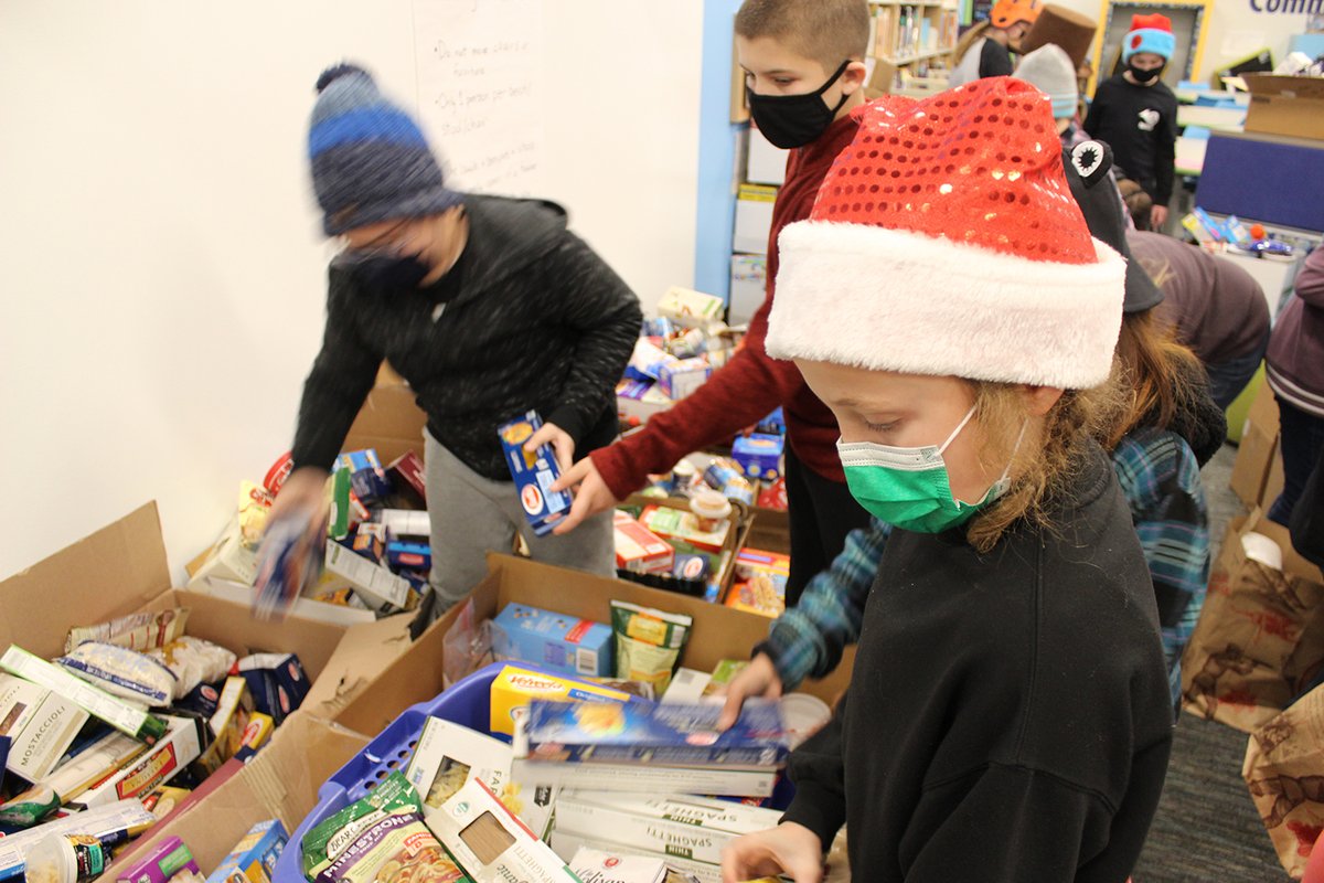 CCSD93's tweet photo. Heritage Lakes students &amp; staff are helping to make the season brighter for local families in need by donating food and other essentials to the Humanitarian Service Project (HSP). Students worked last week to box &amp; stack the impressive array of donations for pickup this week! https://t.co/i3l8QaVVBc