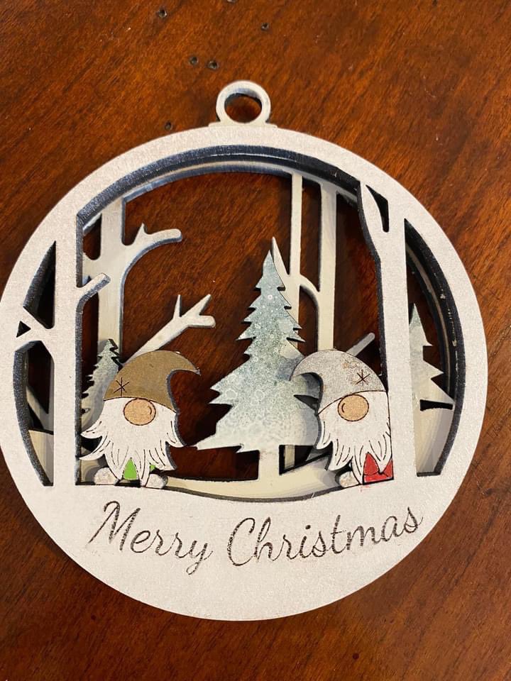 TechnologySab's tweet image. Miss Gaspsparotto using a laser cutter to make beautiful Christmas ornaments.