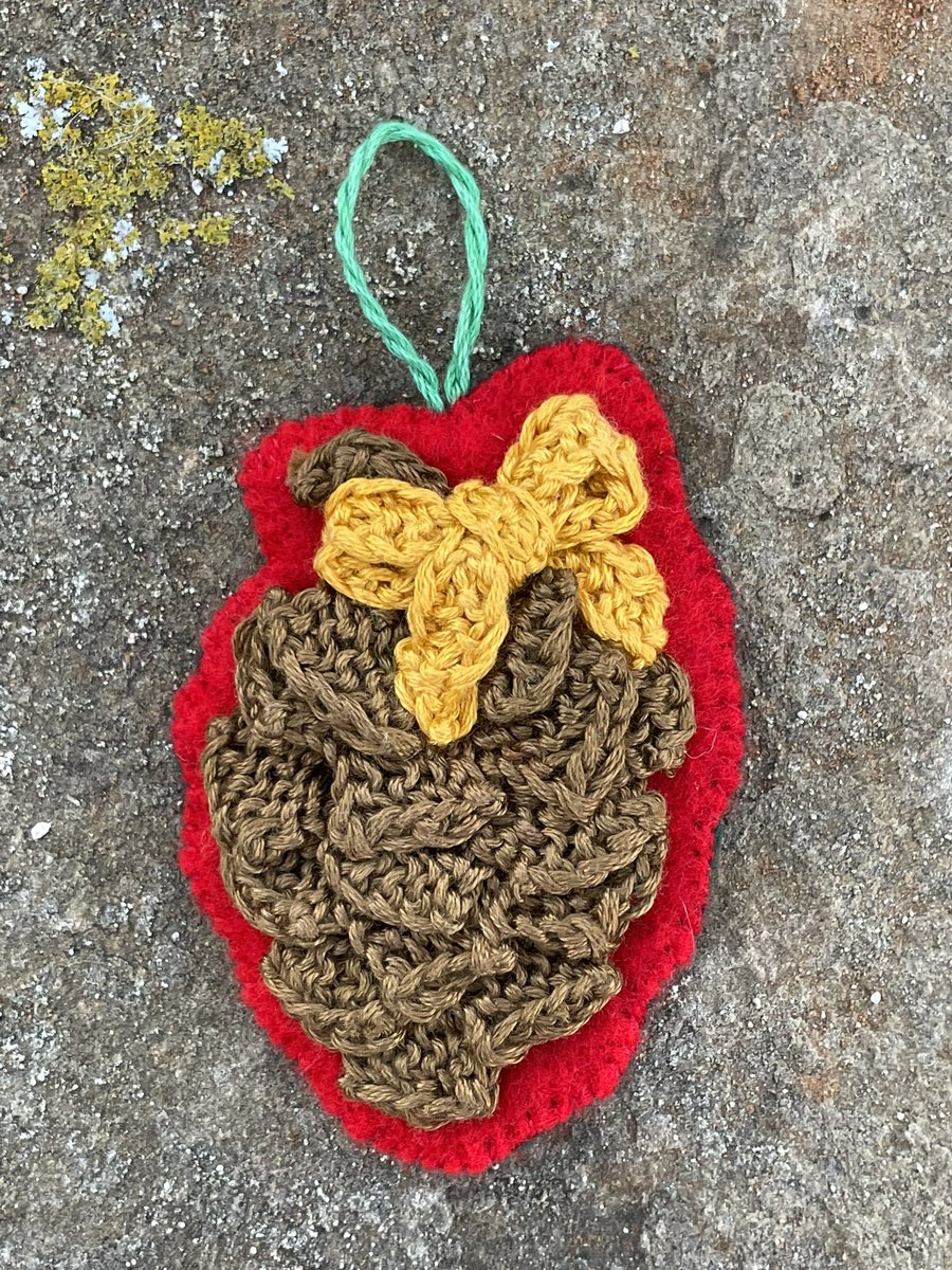 textilefusion's tweet photo. A little pinecone made with a string of garter stitch tabs is Knit Advent Day 13’s Ornament.
#KnitAdvent #AdventCalendar #KnitPinecone https://t.co/d5HHZRw7Sx