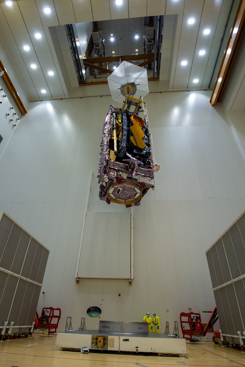 Webb is hoisted to align on top the Ariane 5 rocket.