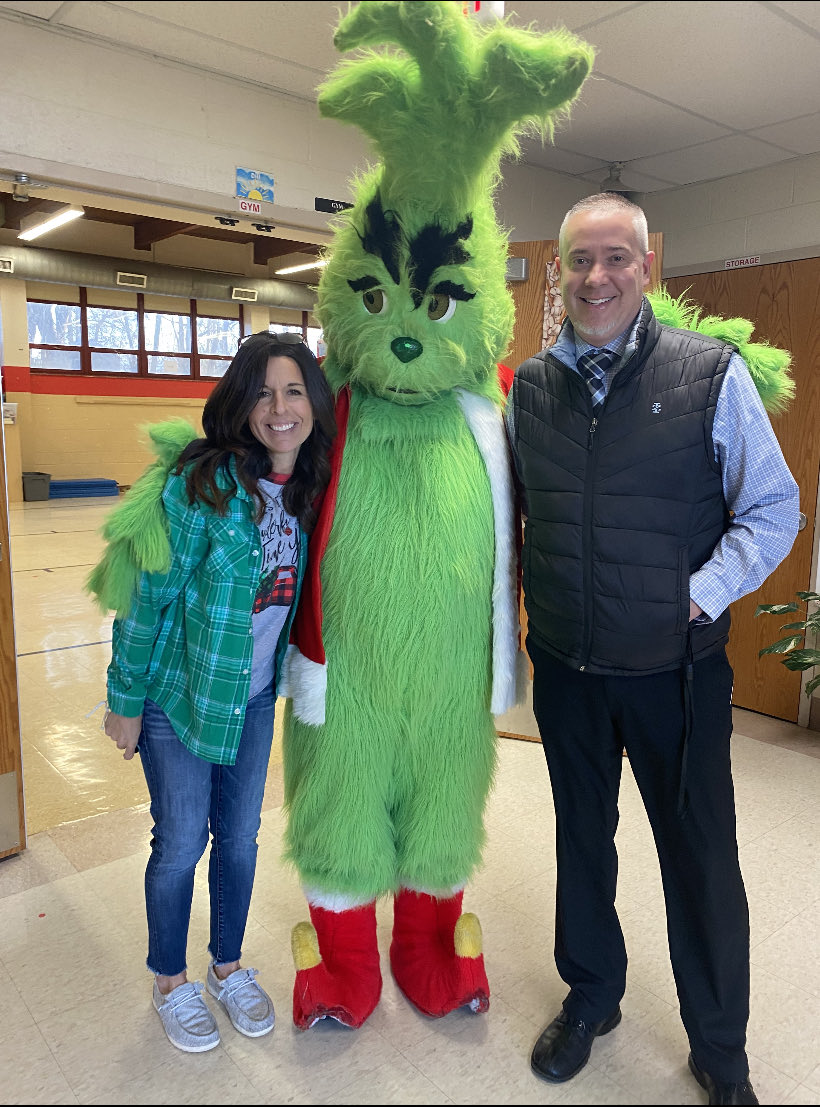 The Grinch greeted kiddos this morning at Fox Elementary!  He seemed to be in a very festive mood! #FoxC6Strong