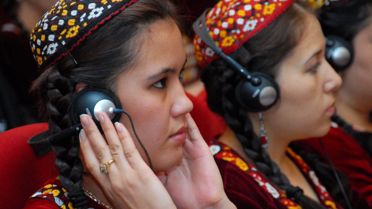 Young women wear headphones