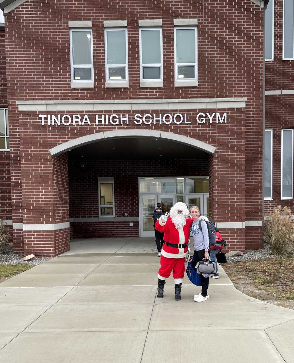 Santa Claus is welcoming students to school this morning!