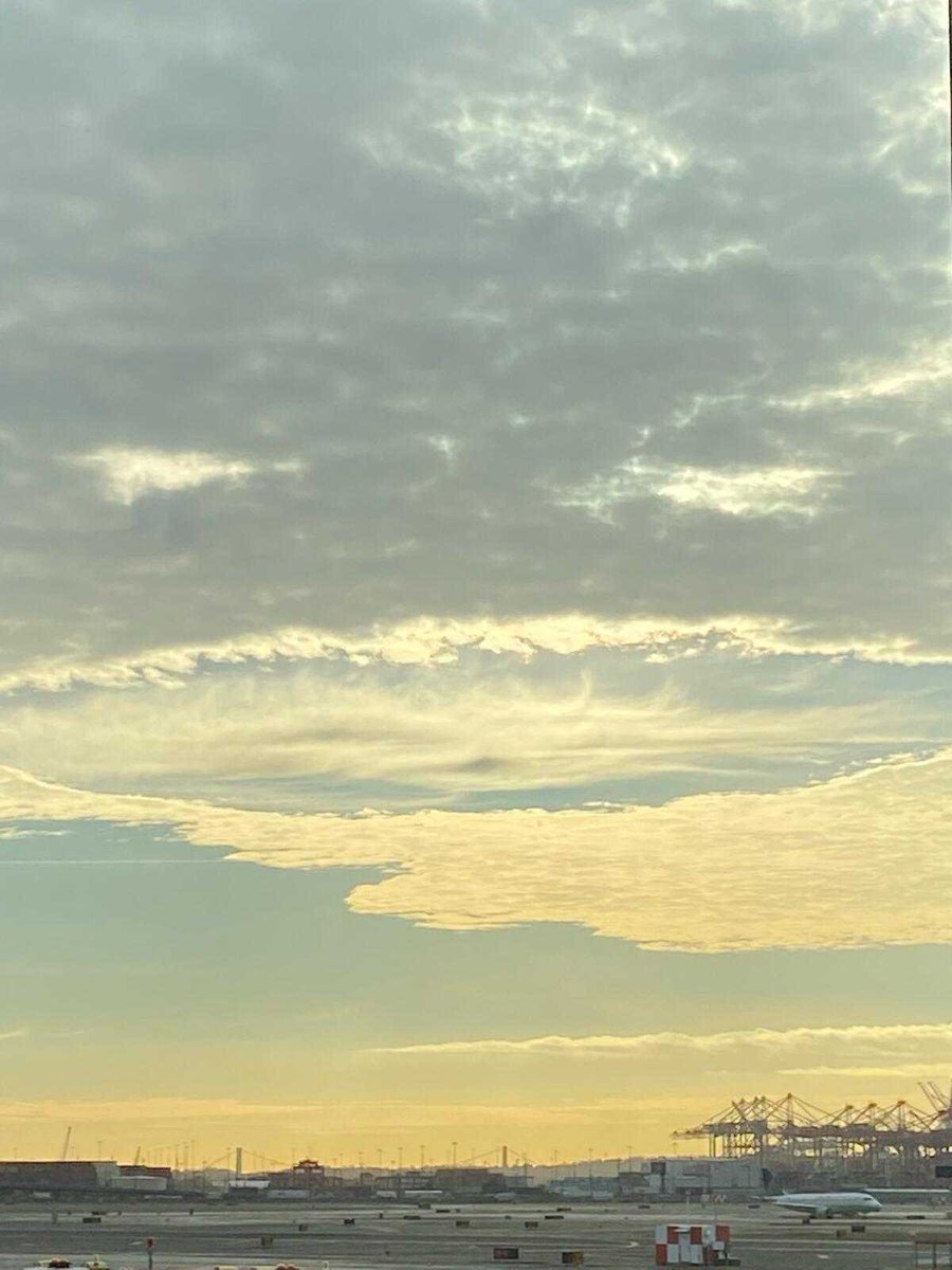 Weathernet1's tweet photo. Fallstreak holes aka 'hole punch clouds' above @EWRairport this morning. These clouds are formed by aircraft flying through the cloud layer✈️(1/2) https://t.co/yeDrQ359Wx