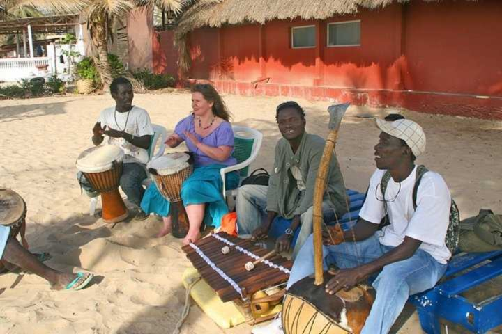 GambianY's tweet photo. The djembe, pronounced jem-bay, is an integral part of life in West Africa. Different rhythms and the accompanying dances are performed at events such as weddings, births, and funerals.#Gambia #Culture https://t.co/gCtsDOz1GQ https://t.co/kHrUncitL9