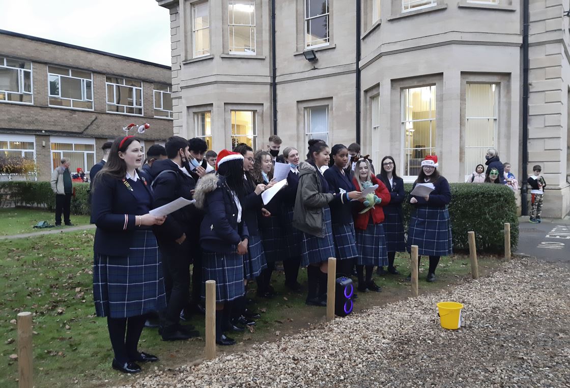 peterboroughsch's tweet photo. Yesterday, a group of Sixth Form students raised money for the School's chosen charity by carol singing. The money raised will go towards the total fundraising efforts this academic year, to @YPCS_UK   ❄️ https://t.co/8e3mrbU5Go