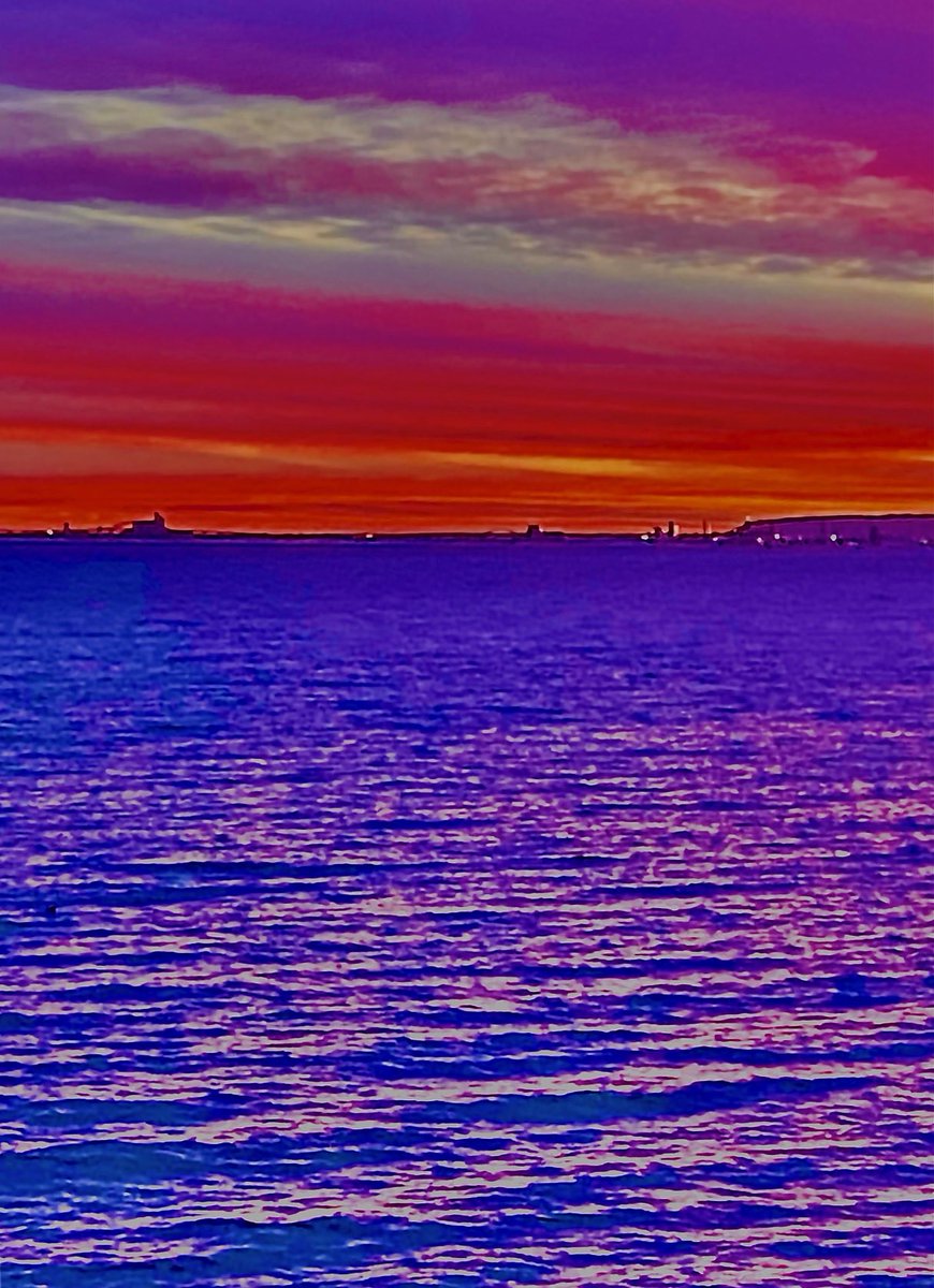 Stunning contrast of Duluth sunset over Lake Superior, by Jack Gilbert.