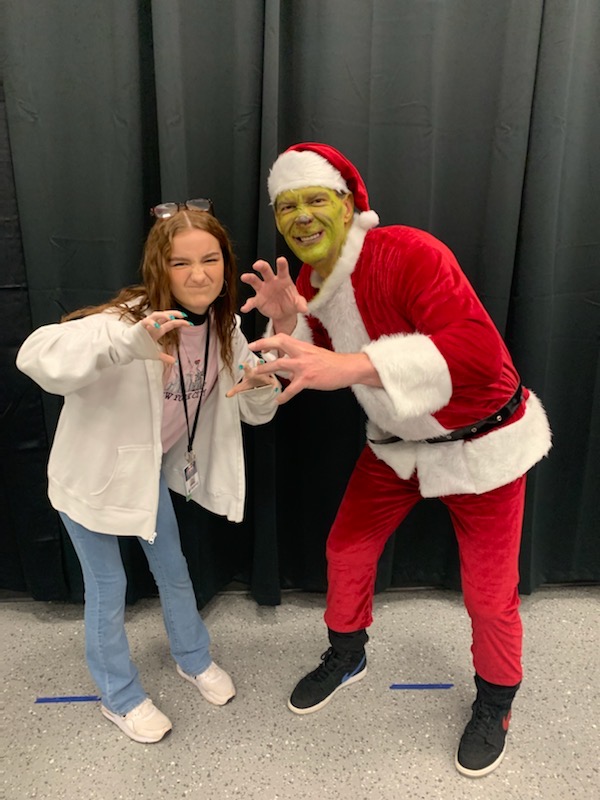MustangSchools's tweet photo. #TMSG - MHS Senior &amp; Theatre President, Nirvana Gscheidle, did #Grinch makeup on @MECmps Principal Daryl Williamson. He spent time reading to students at MEC &amp; will also visit Mustang Centennial to do the same.  #StaffSpotlight #StudentSpotlight #HappyHolidays https://t.co/X8naHQK7pk