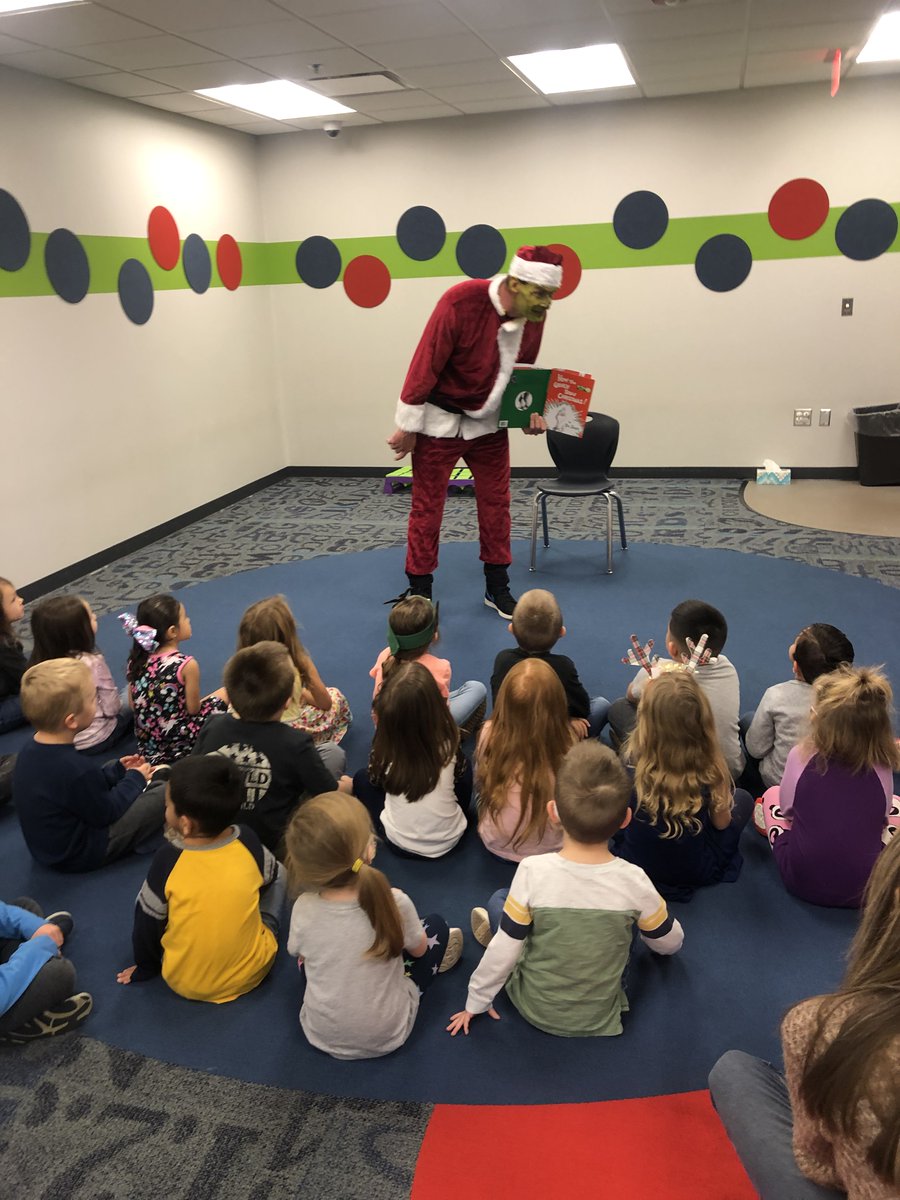 MustangSchools's tweet photo. #TMSG - MHS Senior &amp; Theatre President, Nirvana Gscheidle, did #Grinch makeup on @MECmps Principal Daryl Williamson. He spent time reading to students at MEC &amp; will also visit Mustang Centennial to do the same.  #StaffSpotlight #StudentSpotlight #HappyHolidays https://t.co/X8naHQK7pk
