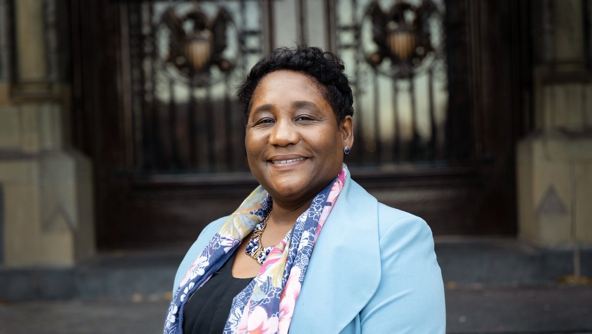 Dr. Roberta Waite poses for an outdoor photograph in front of Healy Hall.
