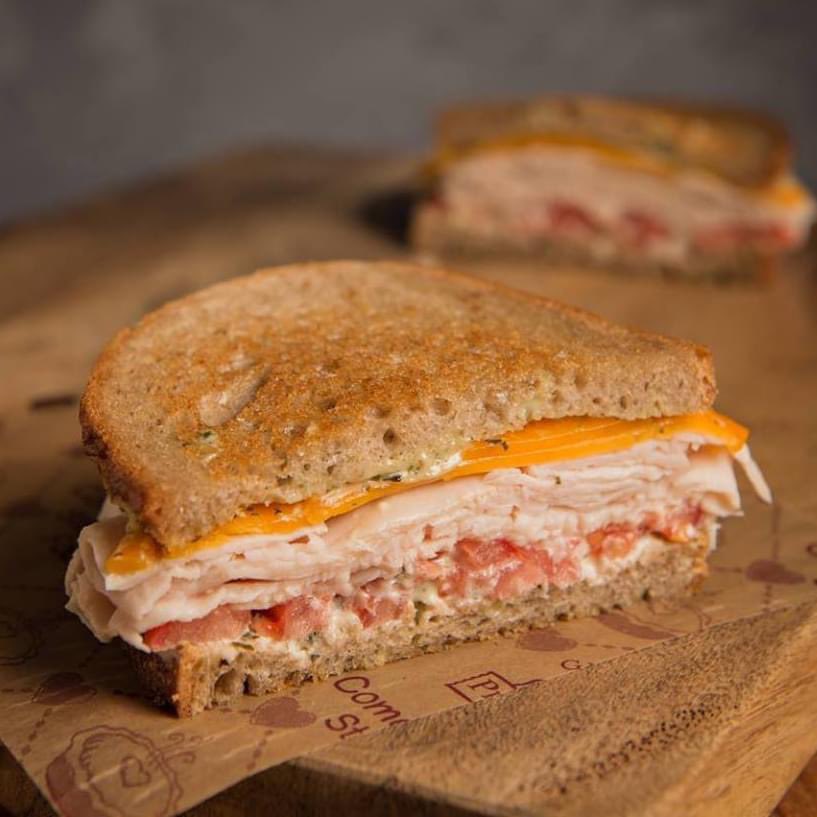Our Lighthouse Turkey sammy will have you 😋😍

Michigan Turkey, cheddar and tomato with pesto mayo on freshly baked whole wheat bread.