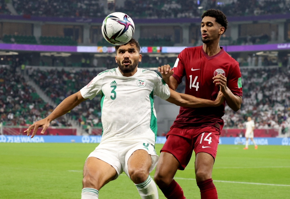 GulfTimes_QATAR's tweet photo. Algeria's Hocine Benayada in action with Qatar's Homam Ahmed.
Qatar 0-0 Algeria
 #FIFArabCup 
#كأس_العرب_2021 https://t.co/ncG09LdBOC