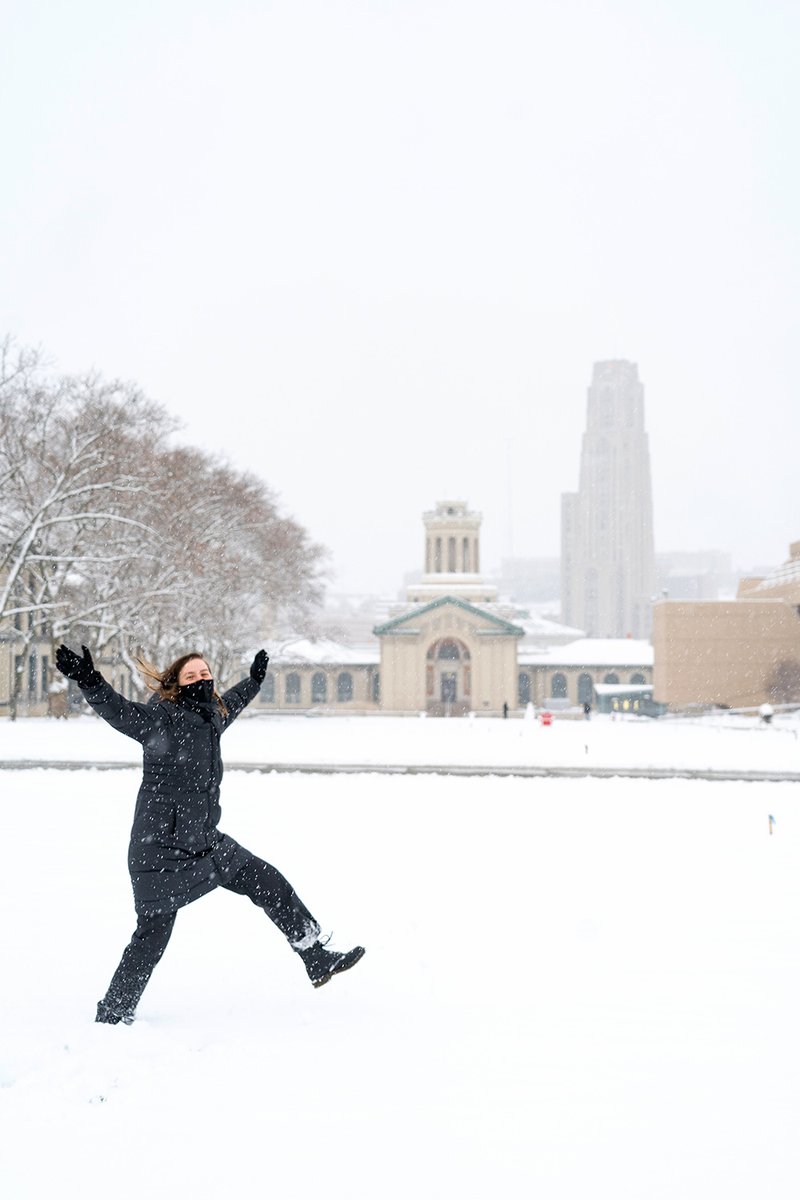 A student playing in the snow on the campus of Carnegie Mellon University in Pittsburgh, Pennsylvania, on Dec. 16, 2020. 