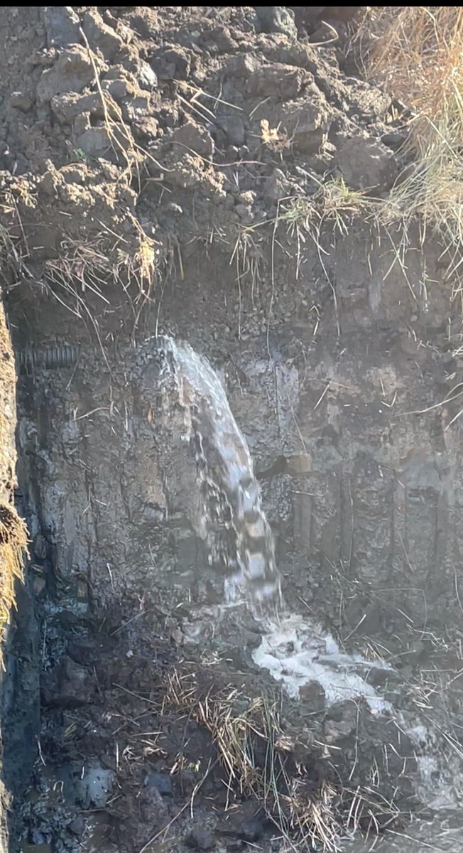 mikewill0786's tweet photo. Several drainage daylights installed vertically during construction.  Impossible to build enough water pressure during rain event for the drain to work properly.  
Dug a hole and cut pipe 40 feet before original daylight.  A 10 min waterfall ensued 😎😎 https://t.co/MOqIuMMBnG