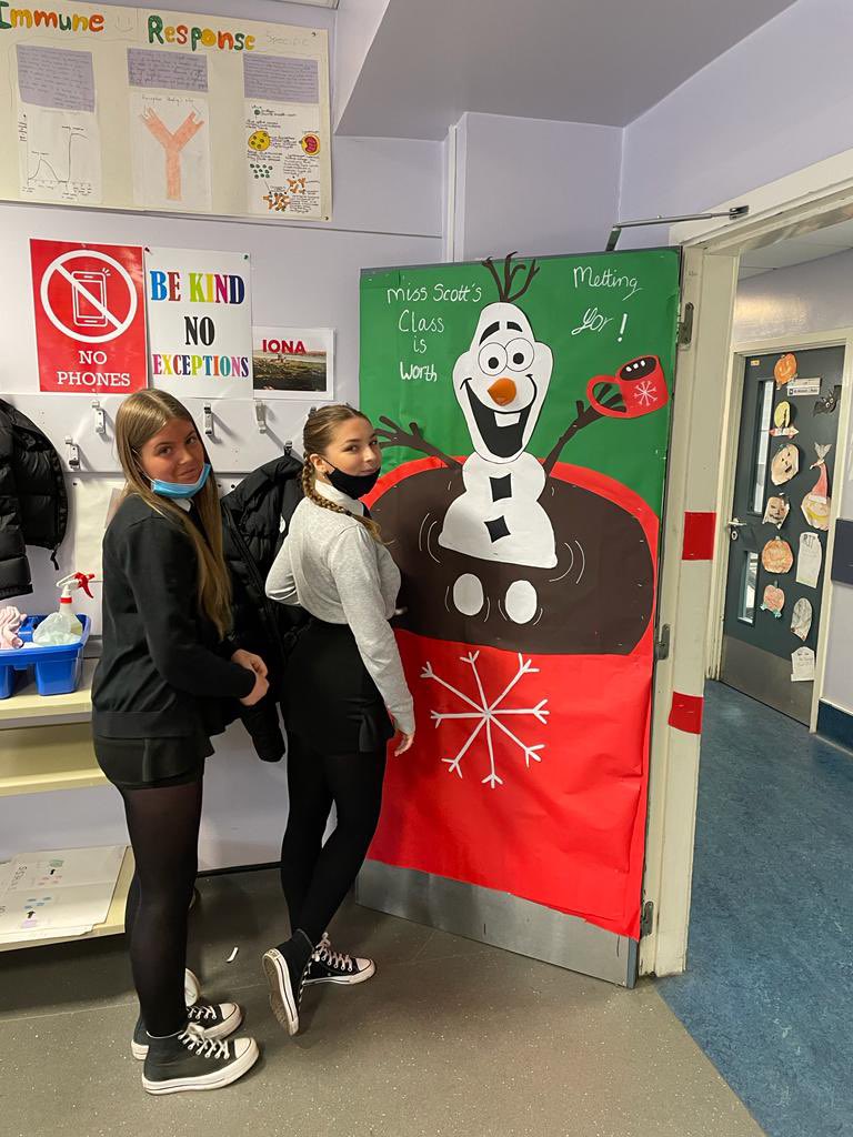 Santa’s little helpers helping decorate Miss Scott’s door for xmas. Looks amazing 🤩 <a href="/JohnstoneHighSc/">Johnstone H.S.</a>