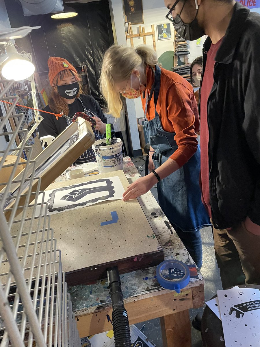 Art &amp; Social Justice students inspect final silkscreen results.  @DTSchoolSeattle @BrianCDTS <a href="/SueABelcher/">Sue Belcher</a> <a href="/veraproject/">VERA Project</a>