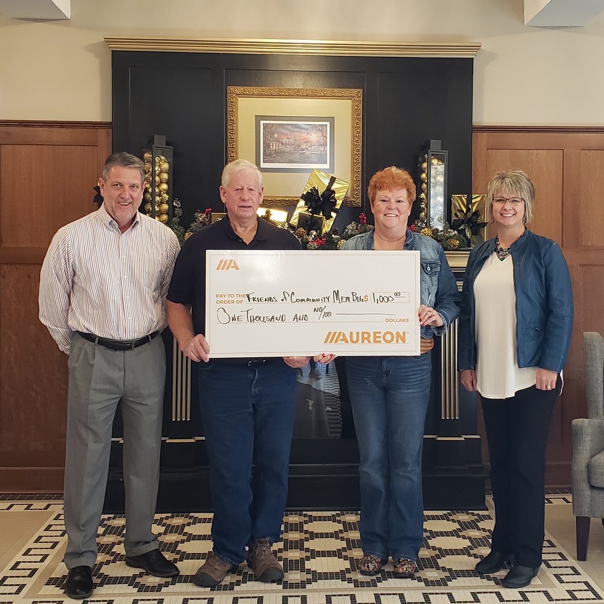 WebsterCalhoun's tweet image. Friends of the Lake City Community Memorial Building received $1,000 to purchase more tables from the Aureon Charity Grant program. 
Pictured are Kent Atha, Aureon; and Marcie Boerner, WCCTA; presenting the check to Dwight Dial and Tami Green.