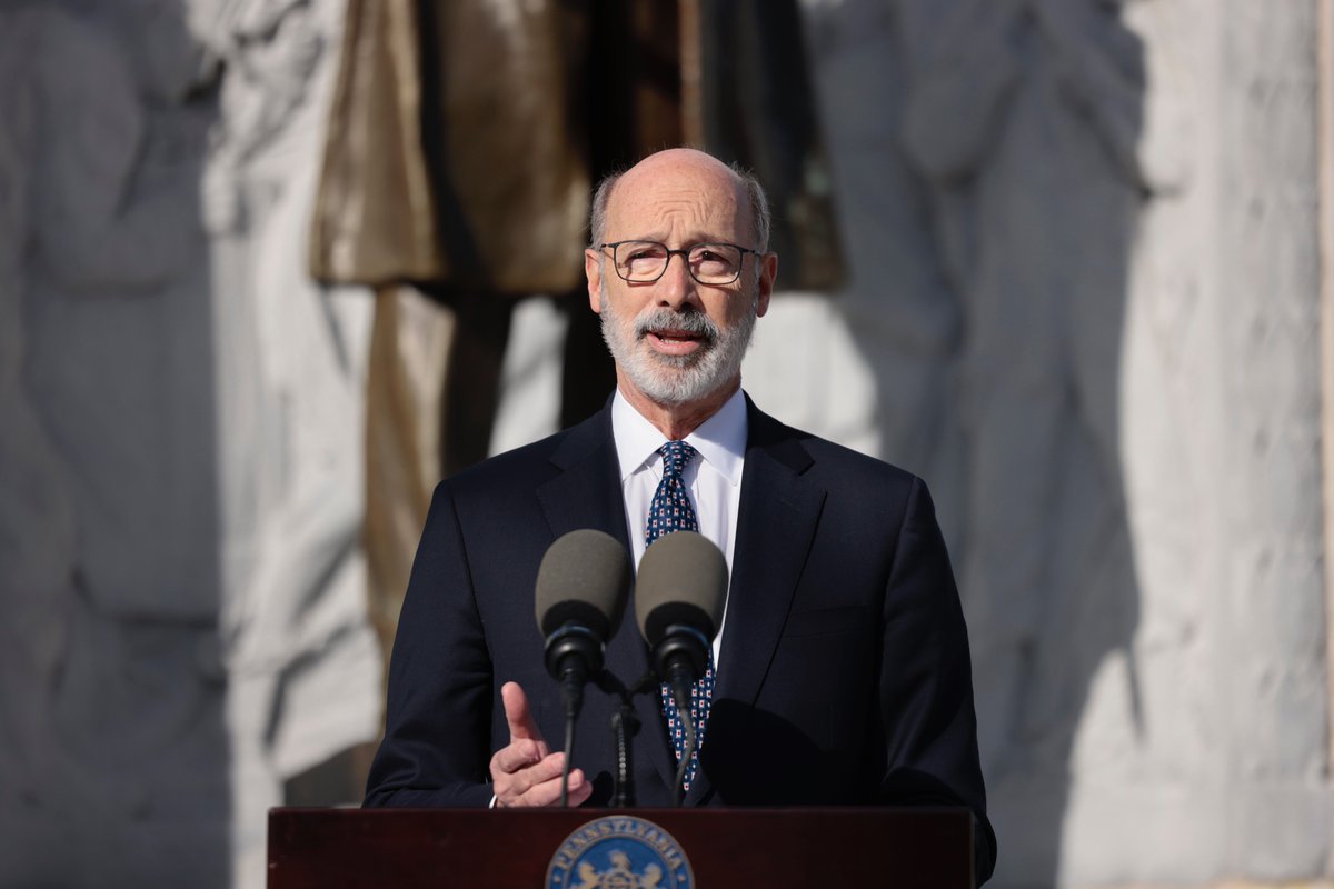 Governor Wolf speaking at a podium in Scranton, PA.