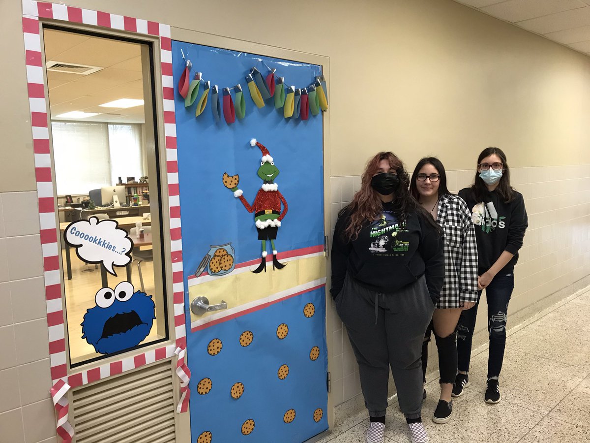 ArtsCpi's tweet photo. Our Christmas Door competition. Kermit eating Christmas cookies and Cookie Monster stuck inside the classroom. All done by the student and done digitally by hand. Very proud of their work!!! 

#workforceeducation
#learningthroughplay
#CTEeducation
#christmas2021 https://t.co/pzkuJ6N6kY