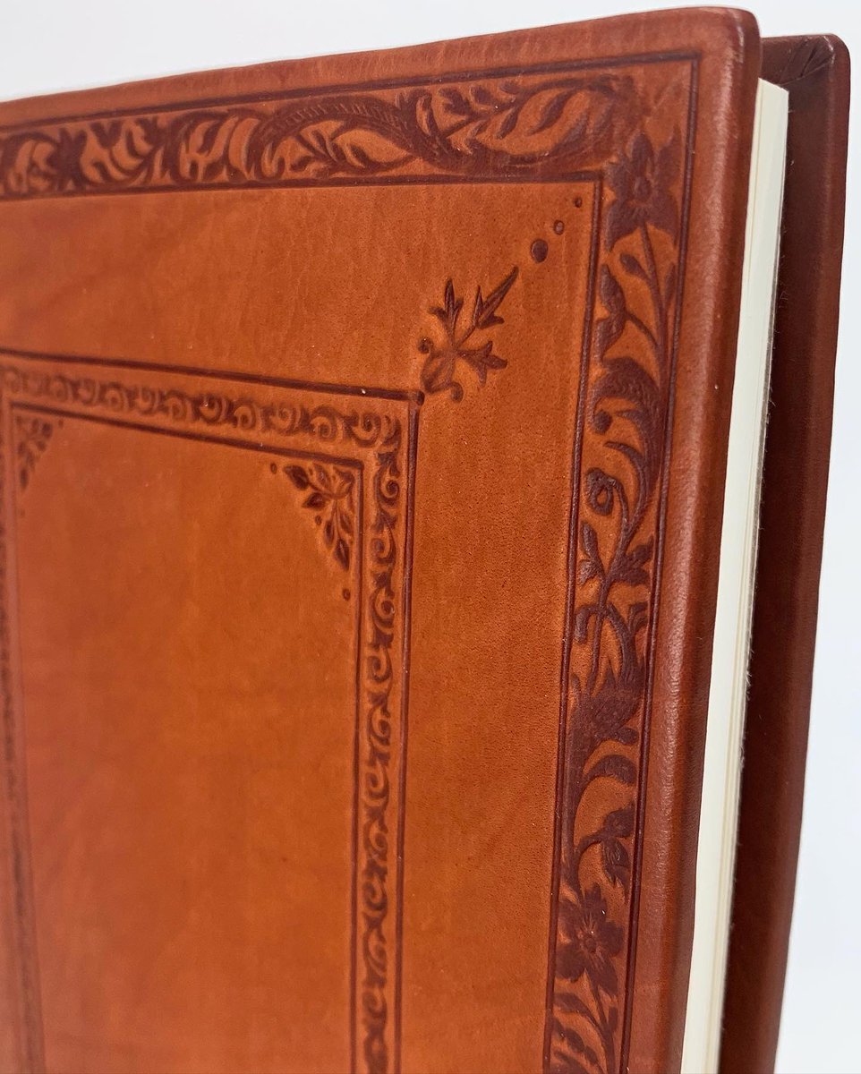 CrowingHensBind's tweet photo. Introducing the Chronicle, a full calf leather journal, tooled in blind using antique finishing tools.

Some shy away from calf because it scuffs &amp; bruises easily. I contend that aesthetic wear is part of the process that makes each journal feel lived in. #booktwt #shopsmall https://t.co/CJzRqSxJg2