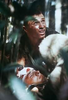 willo1246's tweet photo. A United States soldier comforts a wounded brother as he receives treatment for a wound in the field during fighting in the South Vietnamese city of Hue during the Vietnam War conflict in 1968. https://t.co/5AeN15FoBO