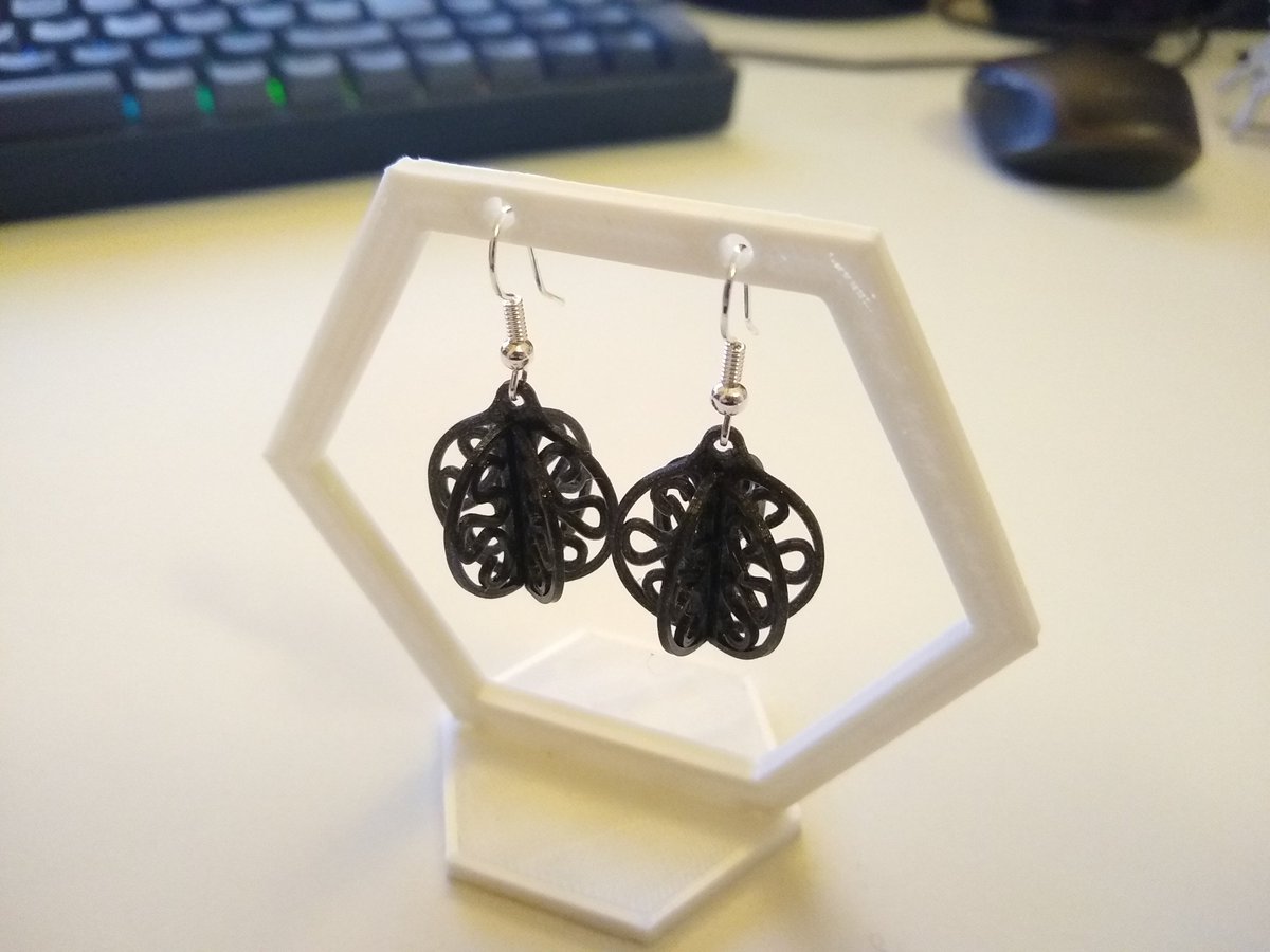 DrLizBish's tweet photo. For #CADvent today I adapted my bauble from yesterday to create these cute earrings. Sorry I won't be sharing the STL for this one but you can buy them on my Etsy shop at https://t.co/7iOGJPowwW #Christmas #Earrings #Advent #Baubles #3Dprintedjewellery https://t.co/3GcNpXXGzG