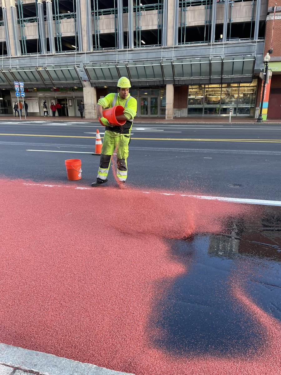 busstopqueen's tweet photo. Experienced firsthand the application of red paint on the new Congress St bus lane, while on a site walk for our @BostonBTD @MattMoran86 North Station to Seaport bus link project with @MBTA 🚍🚏 #mcmahontransit #betterbus https://t.co/JqerN1d1KU