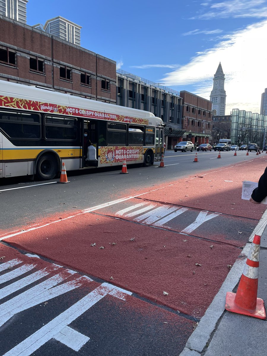 busstopqueen's tweet photo. Experienced firsthand the application of red paint on the new Congress St bus lane, while on a site walk for our @BostonBTD @MattMoran86 North Station to Seaport bus link project with @MBTA 🚍🚏 #mcmahontransit #betterbus https://t.co/JqerN1d1KU