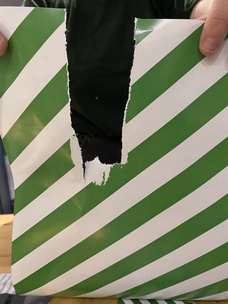 peckhamite2014's tweet photo. @marksandspencer well done on your wrapping paper this year. Your peel away fastenings have either ripped the paper or taken of the print. https://t.co/obZhEMmRNE