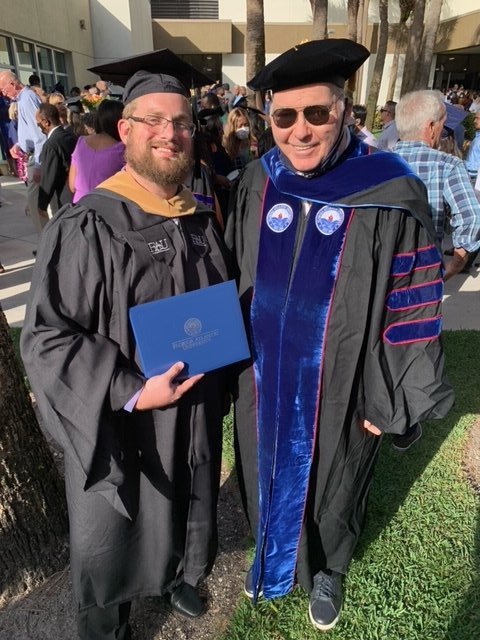 faumbasport's tweet photo. #RusselPhilipp took time out from getting #FAUStadium ready for Saturday's @BocaBowl to "walk" and receive his MBA diploma. Congrats Russell! Fiancee #BriannaOConnor also graduated from our program. @FAUAthletics @faubusiness @FAUExecEd @FAUpresident #FAUGrad https://t.co/Qc0vYPPTPk