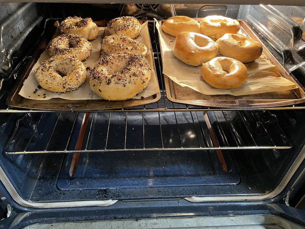 afertig's tweet image. New Year’s Eve dinner will be bagels. I made 22 bagels because I made the bagels too large to get a normal dozen in each. Last batch of bagels of the year pictured finishing baking: