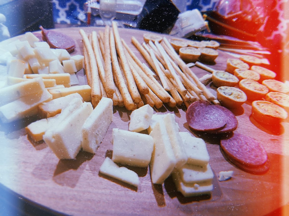 One glass of champagne down and charcuterie board under way