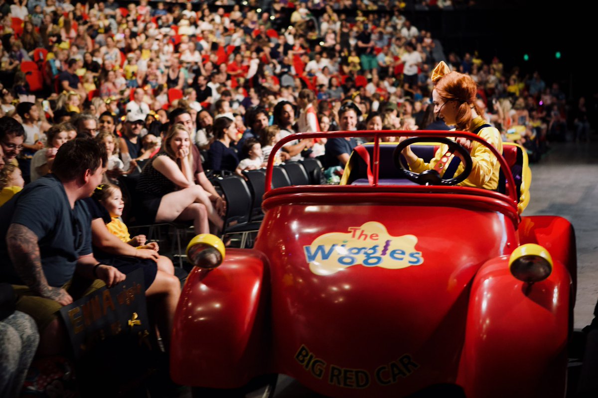 EmmaWatkinsfilm's tweet photo. I’ll certainly miss driving the Big Red Car with Anthony, Lachy and Simon singing along with me 💛 Waving to everyone as we would drive by - one of my favourite @TheWiggles  memories xx Lachy used to have the music in a headphone &amp; he would tap on my shoulder to keep me in time🚗 https://t.co/R9CxX7YYKy