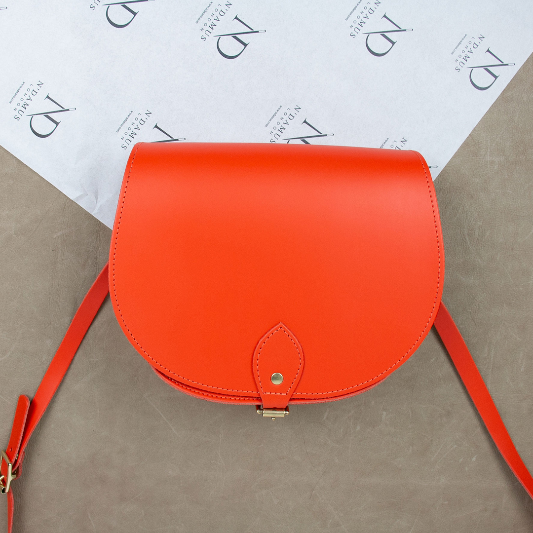 Who's ready for a bright,  fresh and prosperous 2022? Our popular Classic Saddle Bag is now available in tangerine orange.  ow.ly/6nIJ30s5CX1 
-
-
-
-
#ndamuslondon #whatsnew #productlaunch #london #madeinlondon