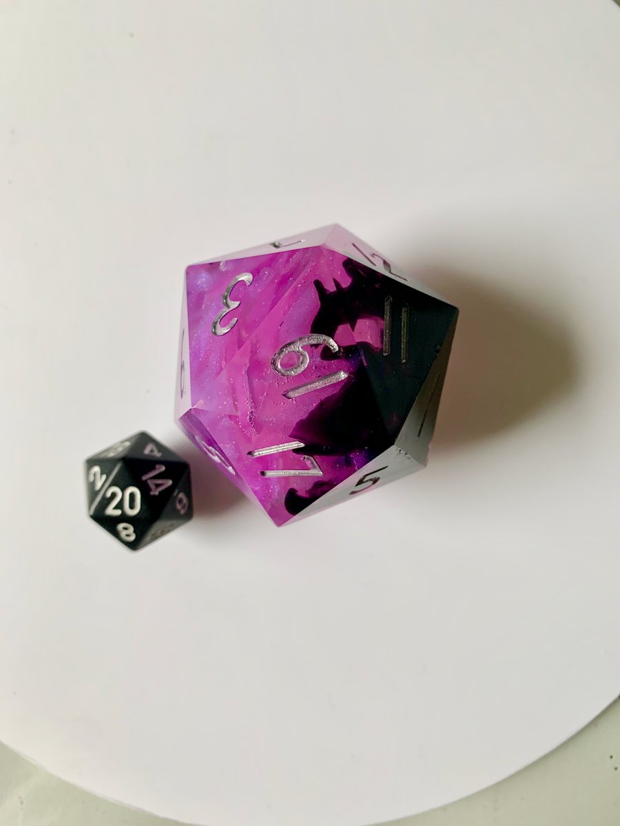 RpgrsD's tweet photo. I need to find this #dice a new home. This is a 50mm (~ 2in) d20. It is one-of-a-kind and could be yours! Shards of pink crystal shattered to release a dark essence #dnd #pathfinder #starfinder #TTRPGs #ttrpgfamily #dnd5e 

To enter the giveaway
❤️ Like &amp;
➡️ Follow &amp;
🔃 Retweet https://t.co/KfHyQLbGHm
