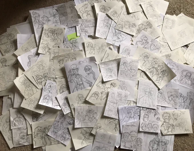 a years worth of drawings! it's easy to forget how much I've drawn until it's all been laid out owo' 