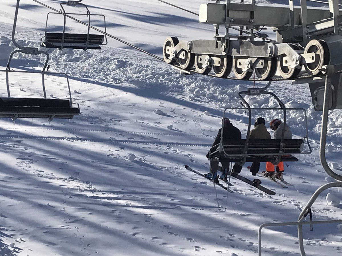 The first skiers &amp; snowboarders get aboard Great Bear’s new chairlift on opening day.