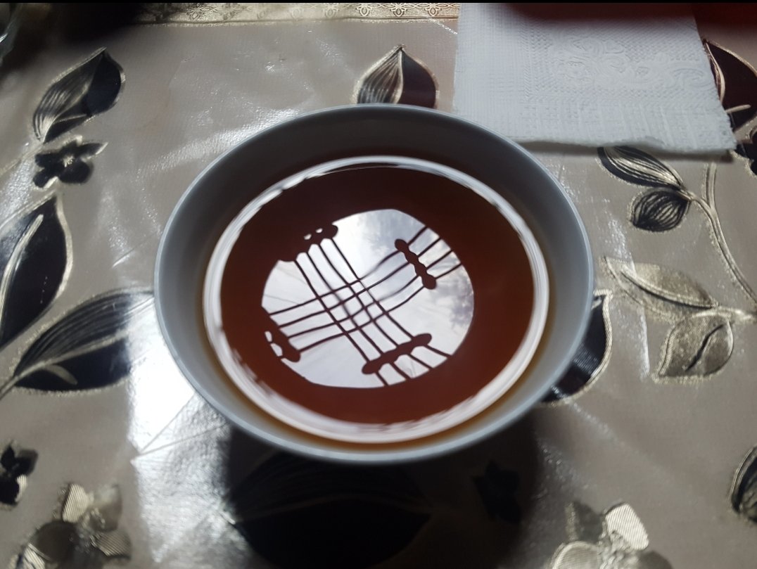 DrLutzBoehm's tweet photo. It's not a current picture from my camera roll but one I feel most proud of as, for me, it grasps a lot of the country's essence. #Tea #Jurta roof frame, national flag. #kyrgyzstan in one picture. https://t.co/NZqiaMXsmC