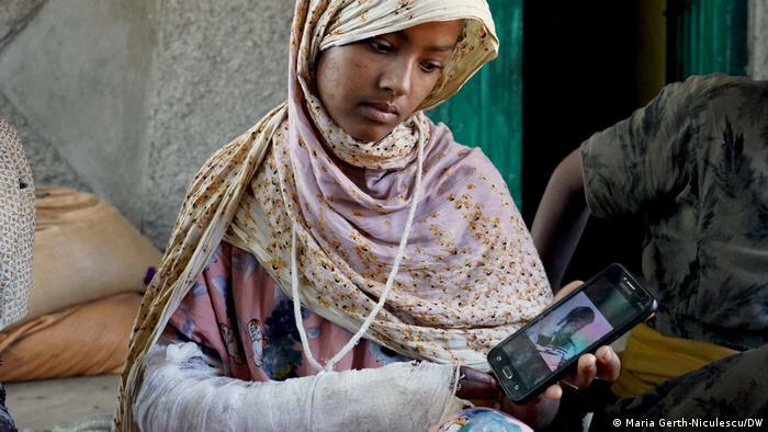Berekethabtamu5's tweet photo. Arabie Hassen, 17, was home with her mother and siblings when a #TPLFTerroristGroup ethnic militia entered &amp; shot at her. Her cousin (pictured on the phone) was killed in an adjacent house on the same day. This family deserves justice! #Lehager https://t.co/iwNpUyGUcf