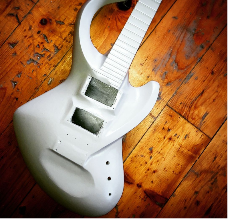 GHServices's tweet photo. A #BassLab guitar in its final sanding and painting steps. It will have Seymour Duncan Screamin' Demon pickups with master volume, tone, and pickup selector switch.
#guitar #electricguitar #hollowbody #carbon #composite #carbonfibre #carbonfiber #6string https://t.co/bUcrRBDSVL
