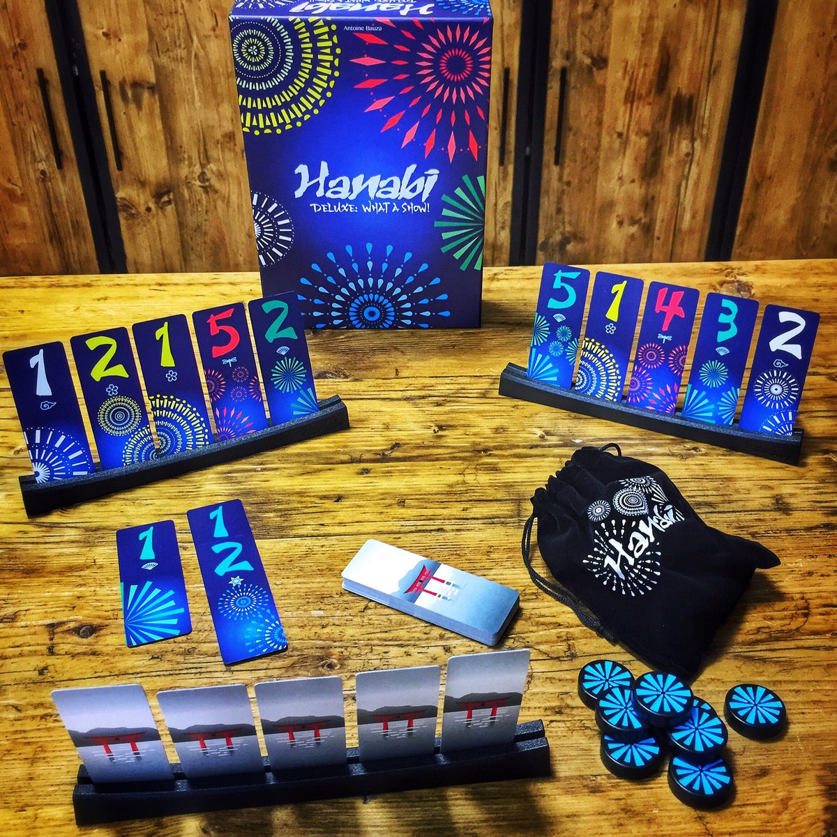 ShuffleCafe's tweet photo. Is there a more aptly themed game to play on NYE than Hanabi? A game all about creating a fireworks display! (This is the awesome deluxe version by @CocktailGames / #coiledspringgames, available to play in the café!) https://t.co/WhY3eQBQBe