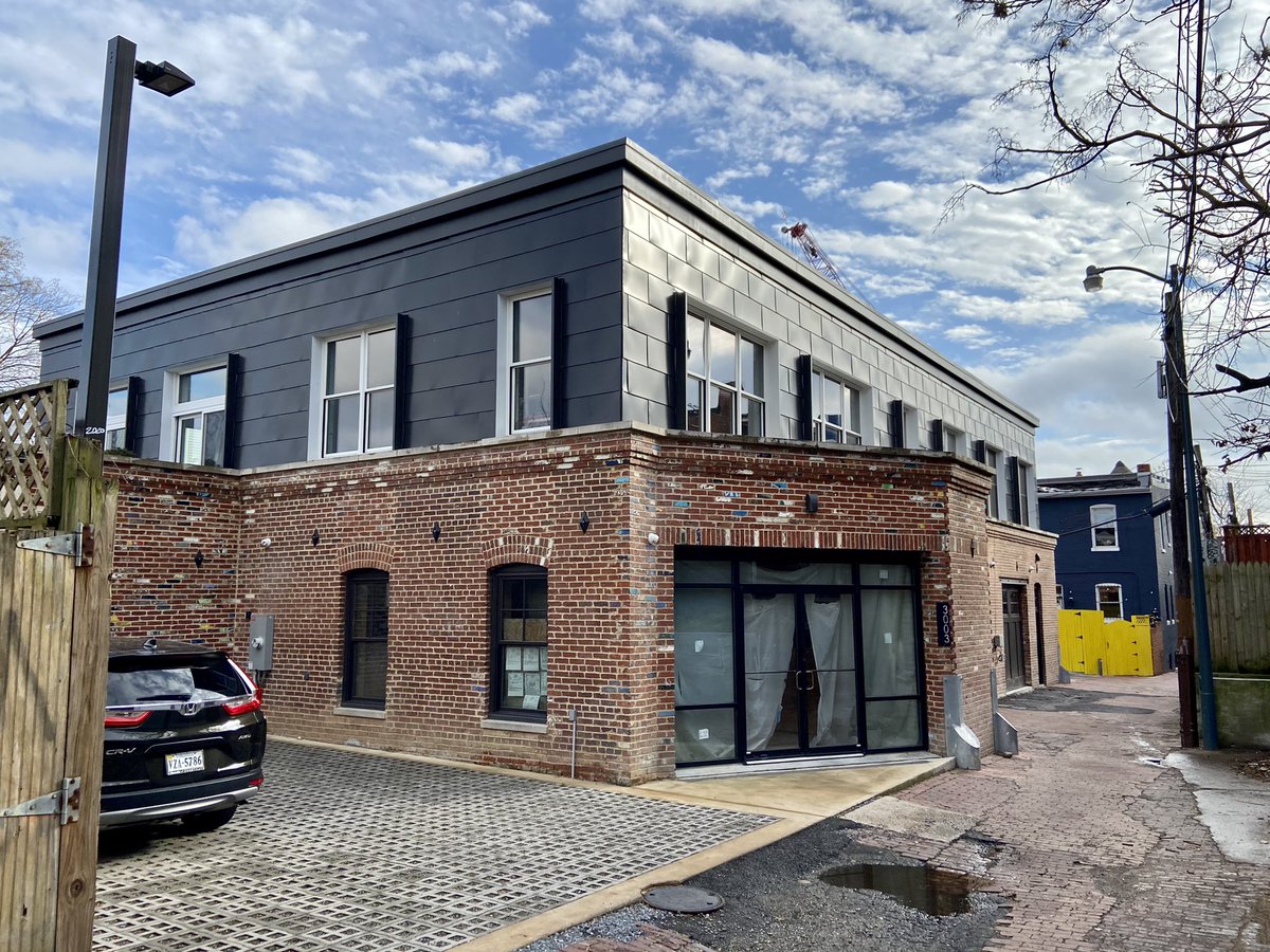 CasesinVirginia's tweet photo. First up is a garage in Columbia Heights. I love alleys so I knew exactly where this was and what was going on today—luxury alley dwellings. Not what was condemned in the mid 20th century. Nice color on bricks along with the “you can’t afford this gray.” https://t.co/sQvxTo4IcY