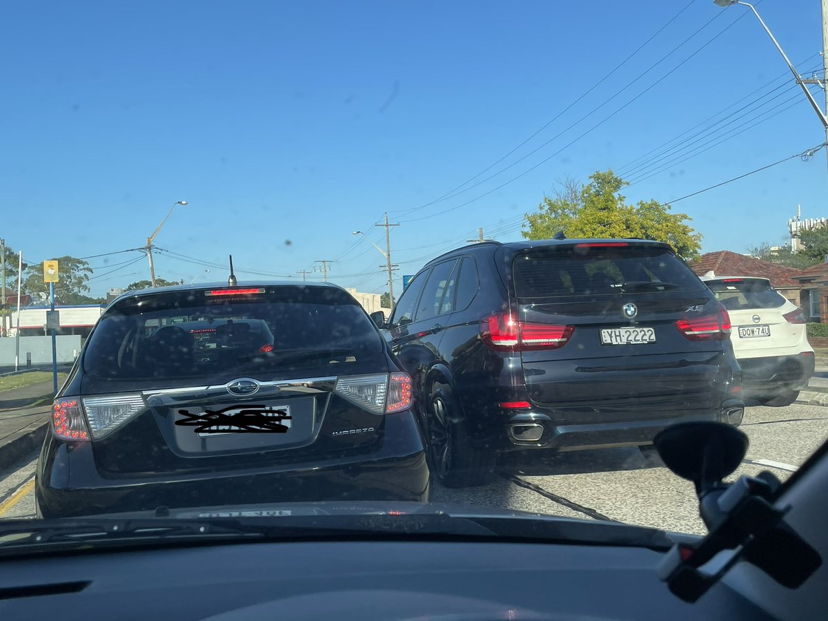 champoyla's tweet photo. This bmw trying to insert the long line through covid testing, and causes traffic https://t.co/jXgduFWz9T