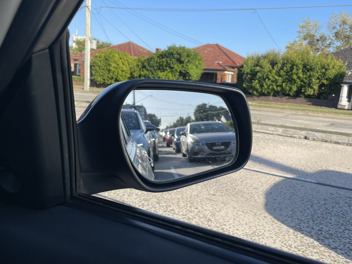 champoyla's tweet photo. This bmw trying to insert the long line through covid testing, and causes traffic https://t.co/jXgduFWz9T