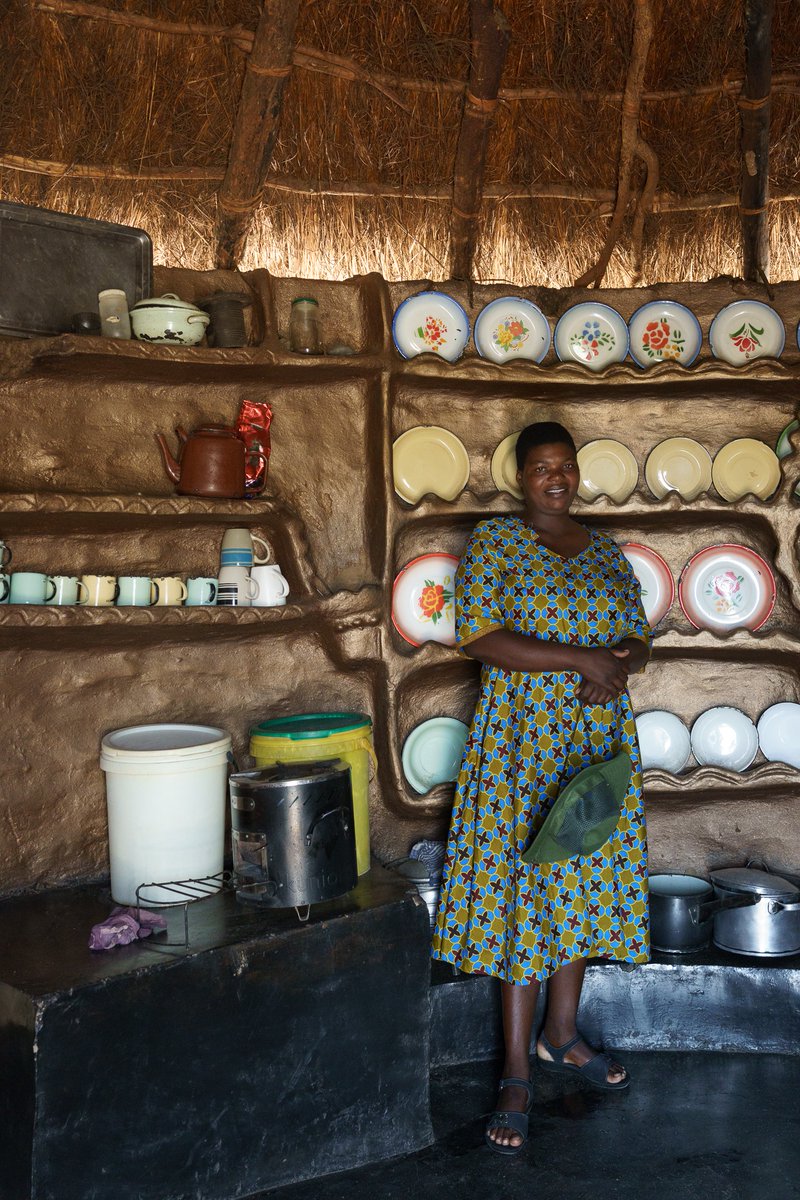 MyTreesTrust's tweet photo. Kitchens in #Chundu are a celebration of the cooks that use them. Walls are colourfully painted and adorned with specially placed plates and cups, and pots shine from all the careful scrubbing theyβve received. πΈFortunate Kazamba in her kitchen with her #SmartStove on the left. https://t.co/Qe1G89ECZx