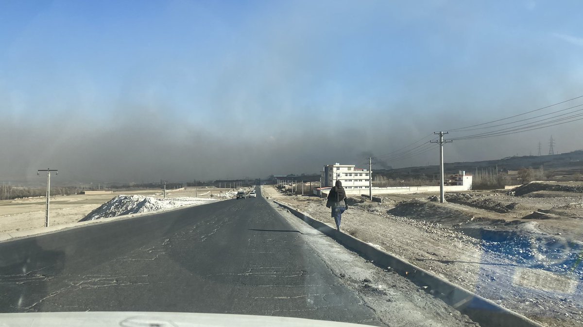 SecKermani's tweet photo. Spent the day self-isolating worried I might have covid… but in fact it was just a bad reaction to the terrible air quality in Kabul right now… this is a pic of the black smog in the city as we approached from the west last week 

Awful air across S Asia a major health issue https://t.co/kTvbQssbNj